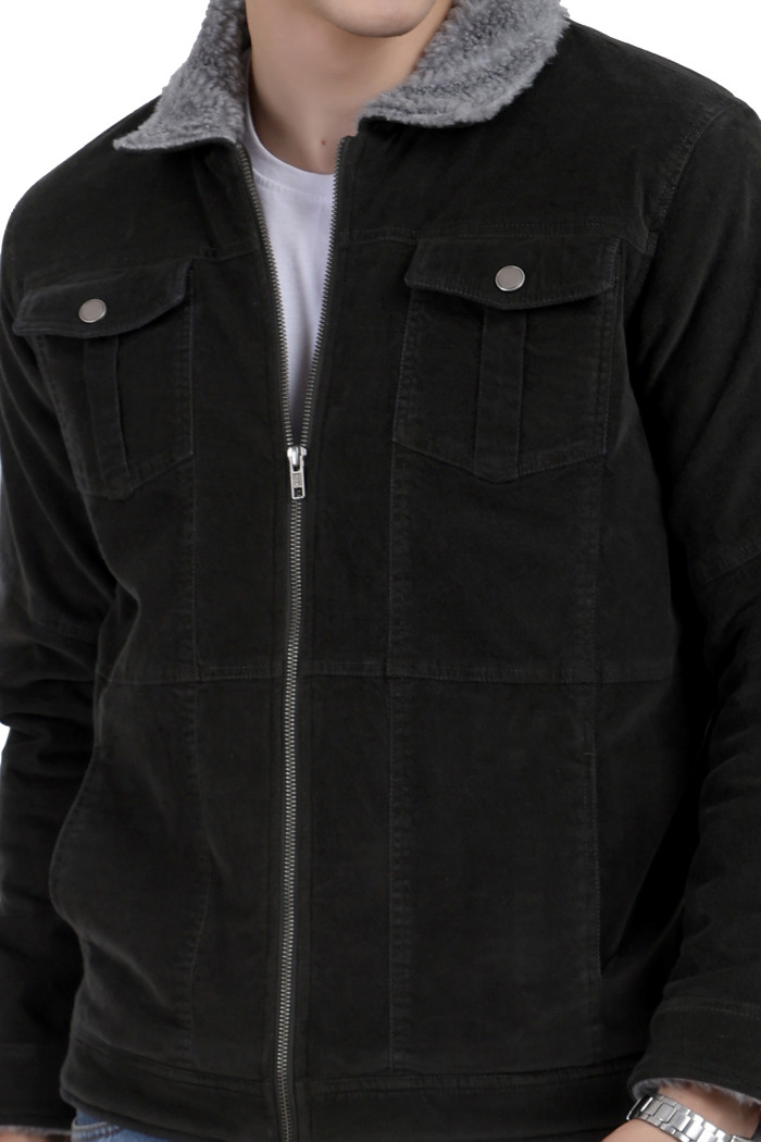 A cropped image of a man wearing a Forest Green Corduroy jacket with a collar neck, zipper closure and pocket in hand designed for casual winter layering and comfort.